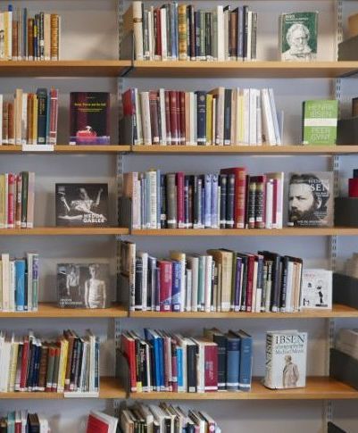A bookshelf filled with Ibsen publications