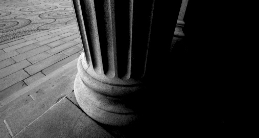 Close up of ionic column.Photo, black and white.