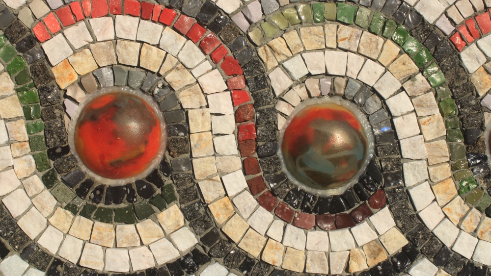 Mosaic tiles showing a pattern of circles and waves