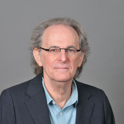 Elderly man with grey hair and glasses. Photo.