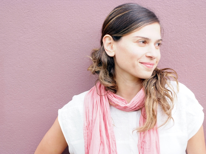 Portrait of Dalia Nasser aganist a pink backdrop.