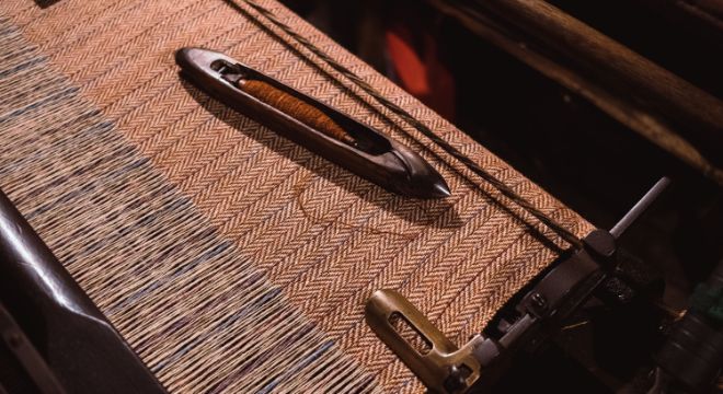 Picture of the weaving of tweed fabric.