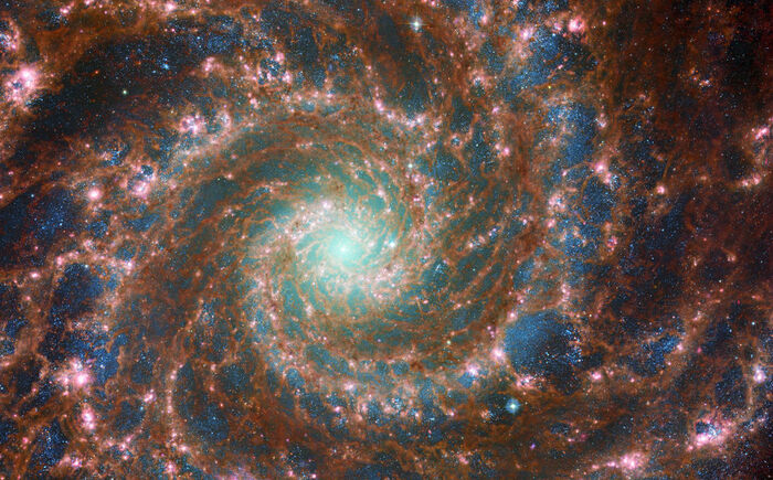 Messier 74 Galaxy image featuring data from both the NASA/ESA Hubble Space Telescope and the NASA/ESA/CSA James Webb Space Telescope.