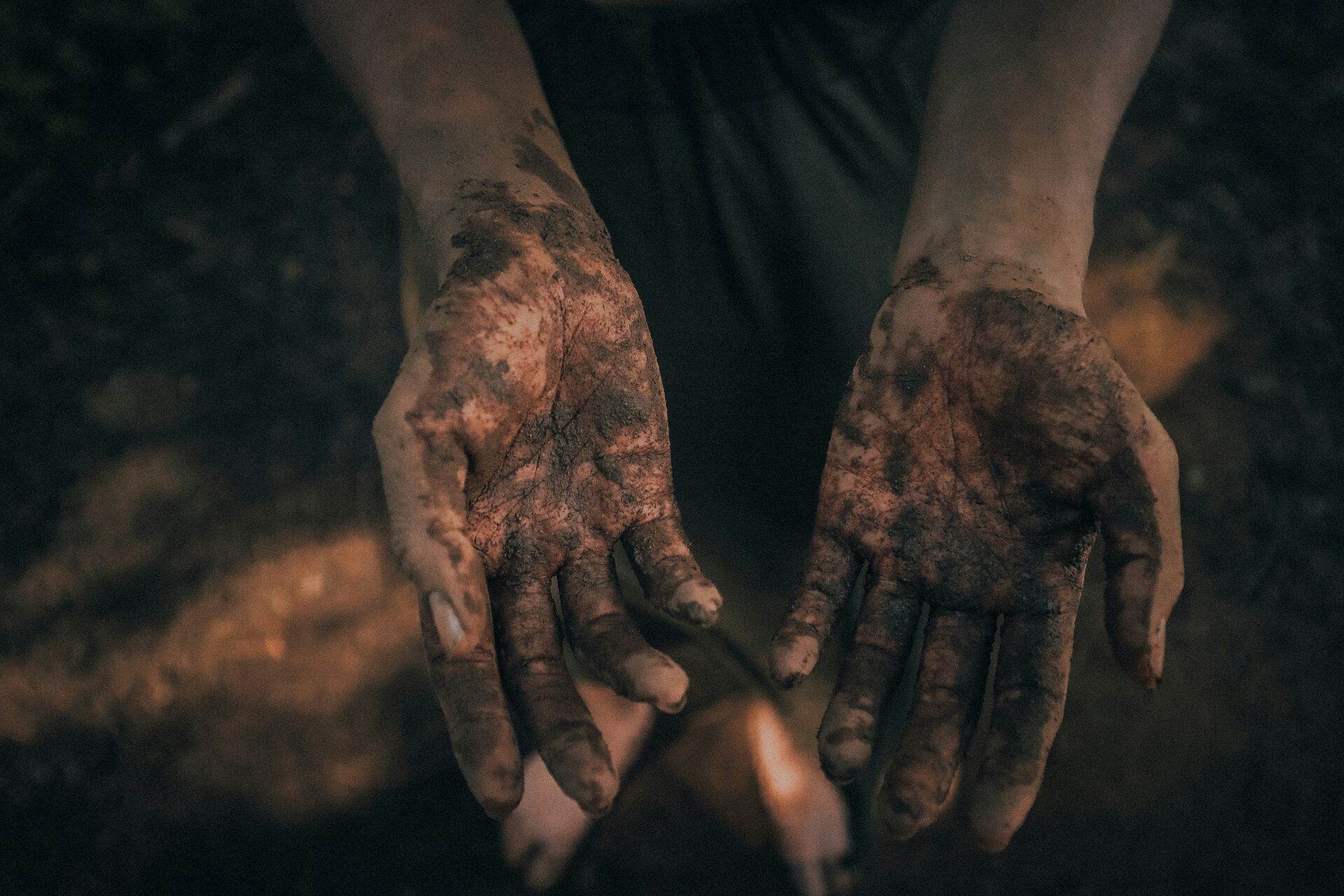 Hands dirty with soil