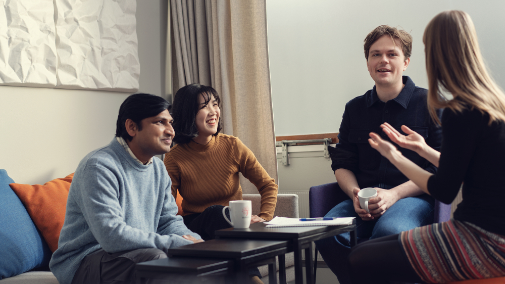 Four people having a conversation