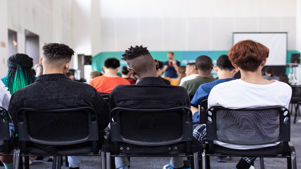 Illustration image with students sitting at the back of a language classroom