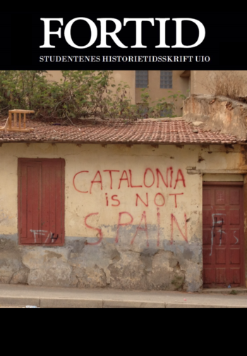 A yellow brick wall tagged with "Catalonia is not Spain" in red