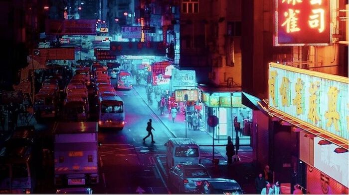 A city at night. Cars, people and neon-lights 