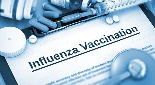 Influensavaksine – sprøyte, ampuller, stetoskop og informasjon