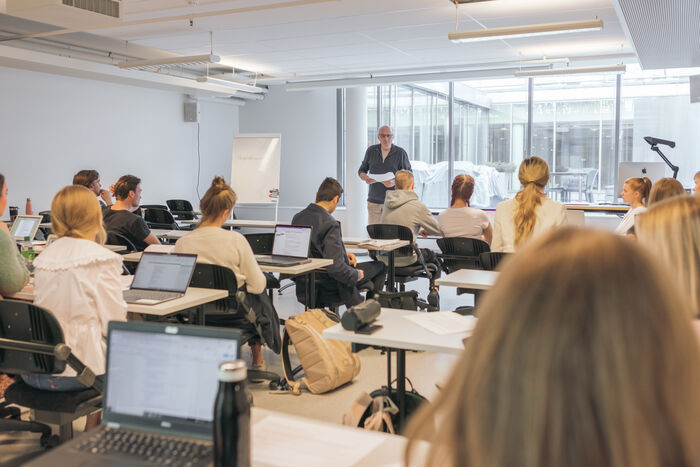 Students in a classroom during a lecture.