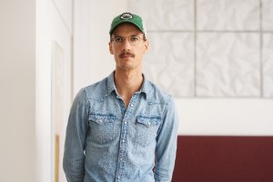 Profile picture of Audun. He is wearing a green cap and glasses.